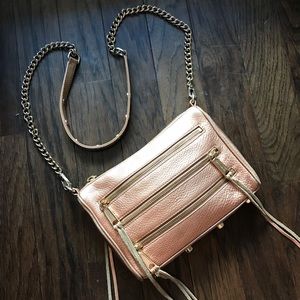 Well-loved Rebecca Minkoff rose gold zipper bag purse